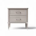 Gray three-drawer nightstand with rounded edges and metallic handles